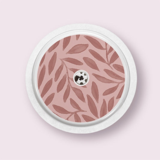 Sticker decorativo para sensor Freestyle 2 con ramas en tonos burdeos sobre fondo rosa empolvado