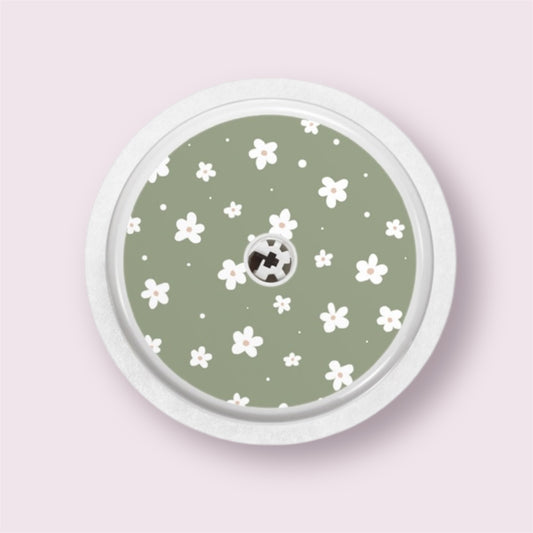 Sticker decorativo para sensor Freestyle 2 con margaritas blancas sobre fondo verde oliva