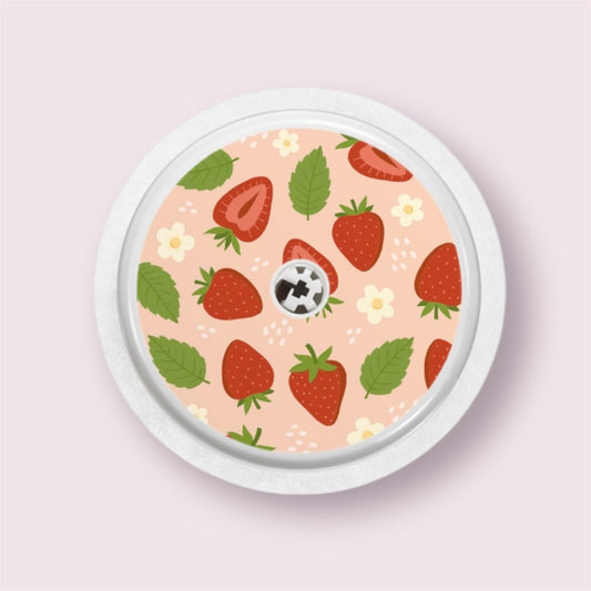 Sticker decorativo para sensor Freestyle 2 con fresas, flores y hojas sobre fondo rosa