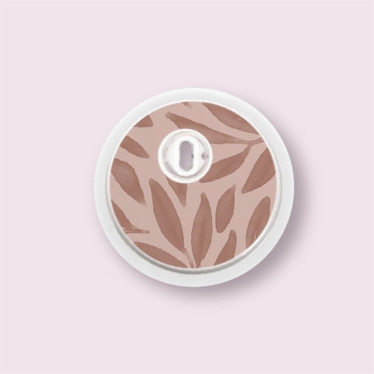Sticker decorativo para sensor Freestyle 3 con ramas en tonos burdeos sobre fondo rosa empolvado